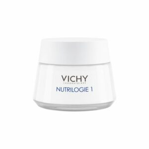 Eine weiße Creme in einem Glasbehälter mit einem grauen Deckel, gekennzeichnet mit "VICHY NUTRILOGIE 1".