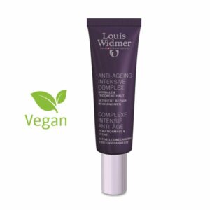 Röhrenförmige Verpackung des Louis Widmer Anti-Ageing Intensive Complex in lila, beschriftet mit veganem Symbol.