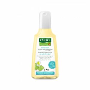 Flasche mit Rausch Herzsamen Sensitive-Shampoo, gelblich mit weißem Etikett und Spender, für sensible Kopfhaut.