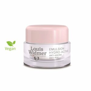 Die Verpackung einer veganen Hydro-Active Emulsion von Louis Widmer mit rosa Deckel und klarer Glasdose.