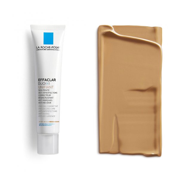 Ein Pflegeprodukt in einer weißen Tube mit blauer Markierung und einer cremigen Farbe daneben.