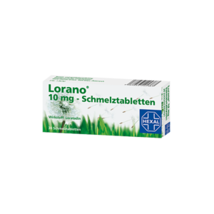 Schachtel mit Lorano 10 mg Schmelztabletten, Wirkstoff Loratadin, Design mit Löwenzahn und grüner Wiese.