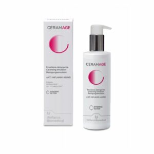 Reinigungsemulsion in einer weißen Flasche mit Pumpe, umgeben von einer Schachtel, beide mit pinken Akzenten.