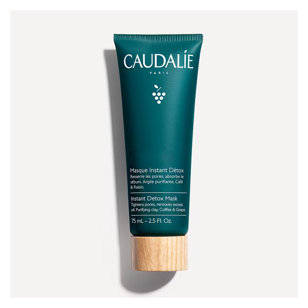 Grünes Tubenverpackung für eine Gesichtsmaske von Caudalie, beschriftet mit "Masque Instant Détox" und Inhaltsstoffen.