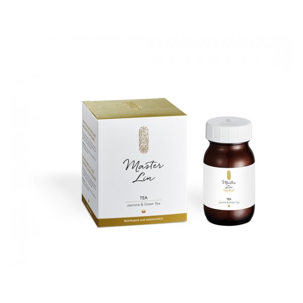 Eine braune Flasche mit Tee aus Jasmin und grünem Tee neben einer weißen Verpackung mit goldenen Akzenten.