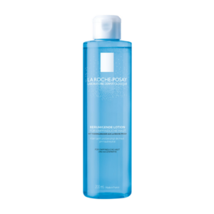 Transparente Flasche mit beruhigender Lotion für empfindliche Haut, hergestellt mit Thermalwasser, 200 ml.
