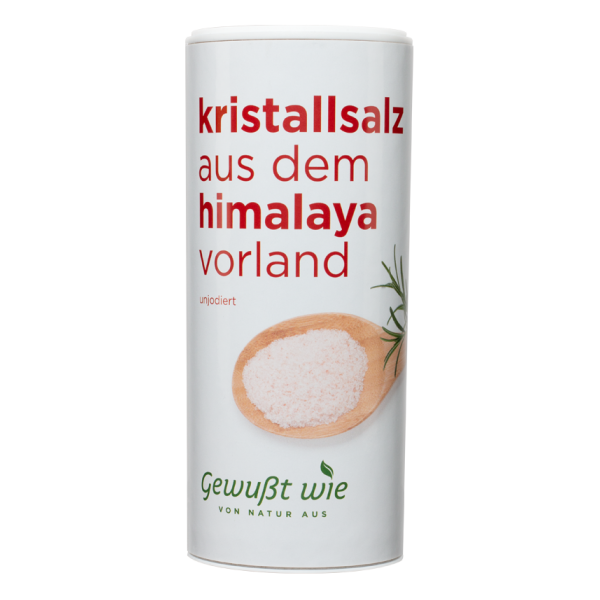 Runde Dose mit Kristallsalz aus dem Himalaya, unjodiert, abgebildet mit einer Schale Salz und Kräuterzweigen.