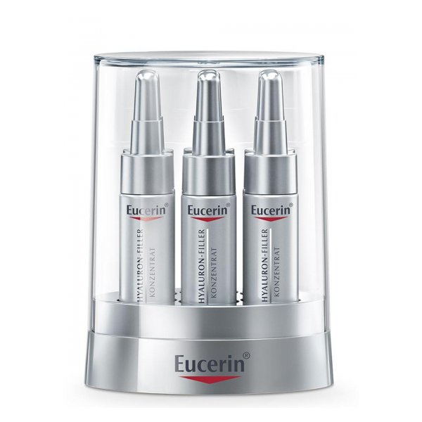 Drei silberne Eucerin Hyaluron-Filler Konzentrate im transparenten Verpackungsständer.
