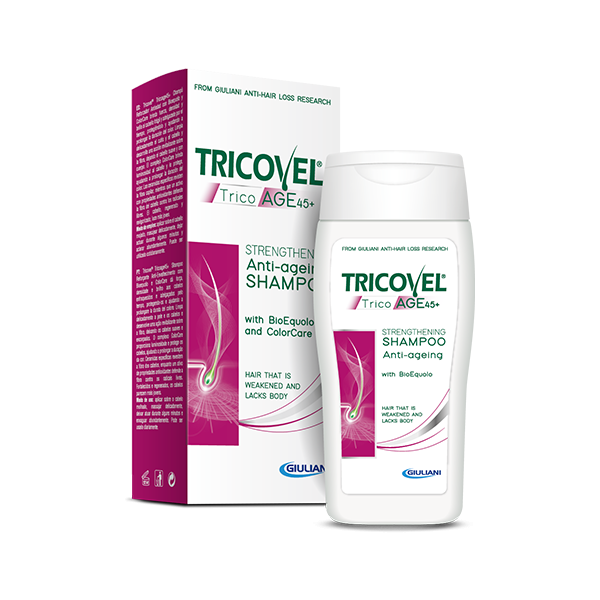 Flasche mit Tricovel Anti-Age-Shampoo, verpackt in einer bunten Schachtel, für geschwächtes Haar.