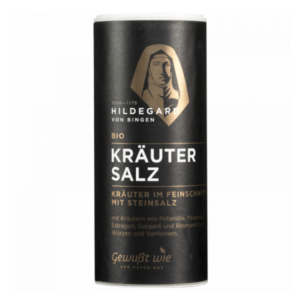 Runde schwarze Dose mit Bio Kräutersalz, abgebildet mit dem Porträt von Hildegard von Bingen und goldenen Akzenten.