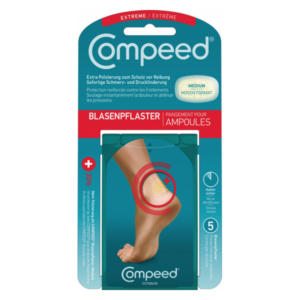 Verpackung eines Compeed Blasenpflasters in mittlerer Größe mit Bild eines Fußes und Beschreibung des Produkts.