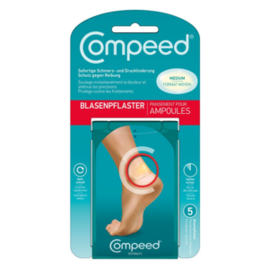 Verpackung eines Blasenpflasters von Compeed in der Größe Medium mit Anweisungen zur Schmerz- und Drucklinderung.