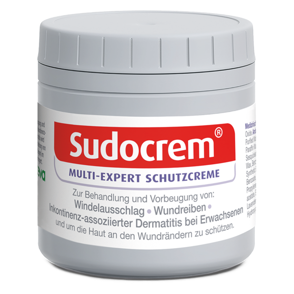 Runde, graue Dose mit Sudocrem Schutzcreme und rotem Schriftzug, behandelt Hautprobleme.