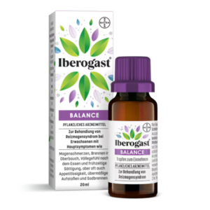 Iberogast Balance in einer braunen Glasflasche mit lila Verschluss, umgeben von einer bunten Verpackung, die pflanzliche Motive zeigt.