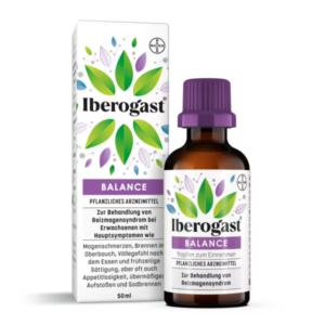 Flasche Iberogast Balance mit lila Kappe, umgeben von einer farbigen Verpackung, die pflanzliche Elemente zeigt.