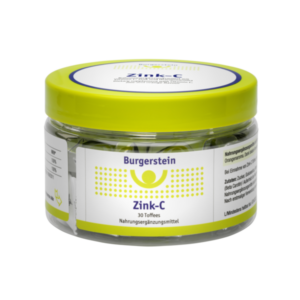 Transparente Dose mit gelbem Deckel, gefüllt mit Zink-C Toffees, Etikett in Gelb und Blau.