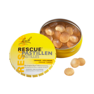 Gelbe Dose mit RESCUE Pastillen, orangefarbene Süßigkeiten mit Blütenessenzen, alkohol- und zuckerfrei.