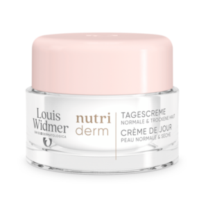 Glasjar mit rosa Deckel, enthält Tagescreme für normale und trockene Haut von Louis Widmer.