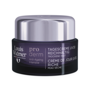Reichhaltige Tagescreme mit UV-Schutz für trockene Haut in einem violetten Tiegel von Louis Widmer.
