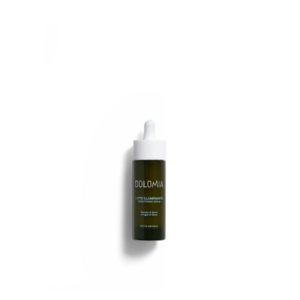 Dunkelgrüne Flasche mit Pipette für ein aufhellendes Serum von Dolomia, etiketiert mit Inhaltsstoffen und Anwendungshinweisen.