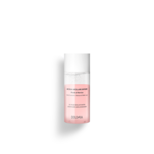 Zweiphasen-Mizellenwasser in einem transparenten Behälter mit pinker Flüssigkeit und einem weißen Deckel.