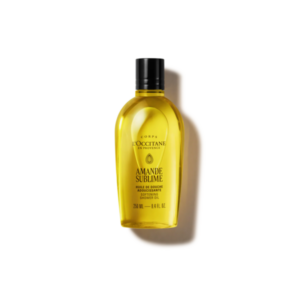Flasche mit pflegendem Duschöl von L'Occitane, gelbe Flüssigkeit, schwarzer Verschluss, Etikett "Amande Sublime".