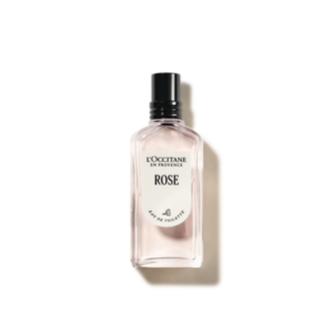 Flasche L'Occitane Rose Eau de Toilette mit klarer, rosafarbener Flüssigkeit und schwarzem Verschluss.