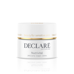 Weißer Cremetiegel mit goldfarbenem Deckel, beschriftet mit "Nutrivital" und "beauty for sensitive skin".